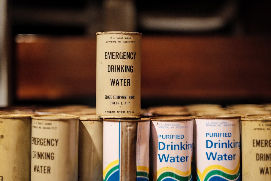 A clean, organized storage area with water containers ready for emergency use.